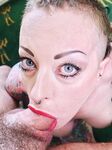Tattooed female Piggy Mouth slurps on a dick before vaginal sex