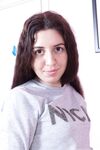 Dalila starts shameless masturbation of hairy pussy in her room