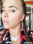 Young looking Latina girl Olivia hides her huge tits while taking selfies