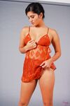 Sexy Indian pornstar Sunny Leone sheds sheer lingerie baring pierced nipples