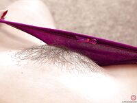 Older MILF shows off nice ass before spreading hairy cooter