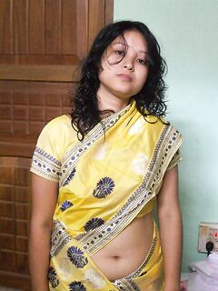 Indian wife changes attire while pleasuring her husband on bed POV style