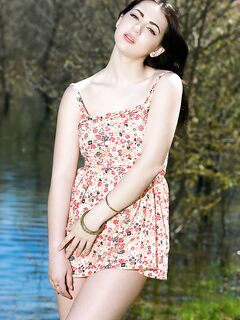 Brunette babe shedding summer dress outdoors for teen glamour photos