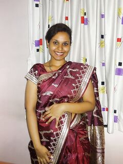 Clothed Indian woman strips to her black bra and underskirt