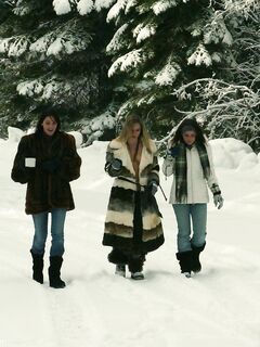 Three big boobed stunners pose braless in their fur coats in the snow