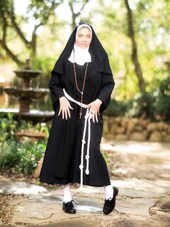 Thick nun bares her big naturals before showing her ass and twat in courtyard