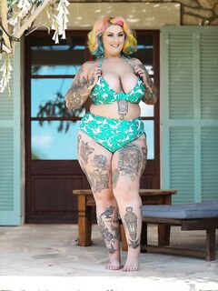Inked BBW with rainbow hair Galda Lou exposes her huge melons and big butt