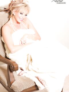Busty classy mature Rachel Aziani poses naked wearing a string of pearls