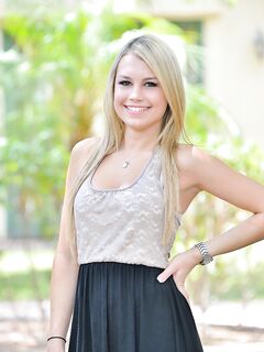 Cute blonde girl in black thong posing for sexy upskirt on the street