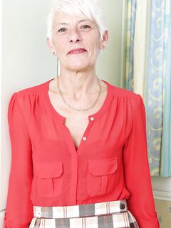 Over 70 Bristish granny takes off her clothes and lingerie striptease style