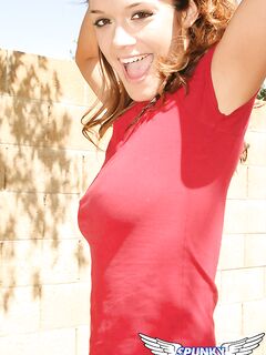 Teen amateur Brittany Maree places hands over her naked breasts while outdoors