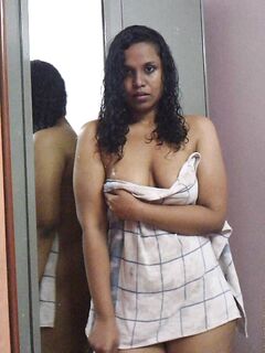 Indian plumper Lily Singh shows her bare ass and natural tits afore a mirror