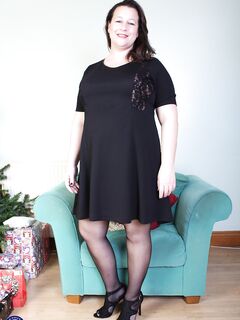 Brunette mom Eva Jayne removes her black dress and flaunts her curves
