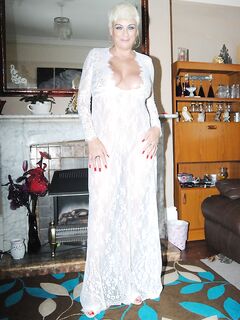 Older woman Dimonty pulls her tits out of long lace dress wearing no panties