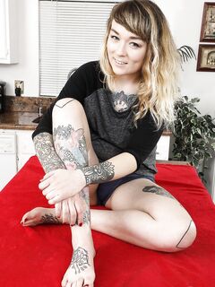 Tattooed blonde Felicia Fisher spreads her very hairy meaty pussy wide open